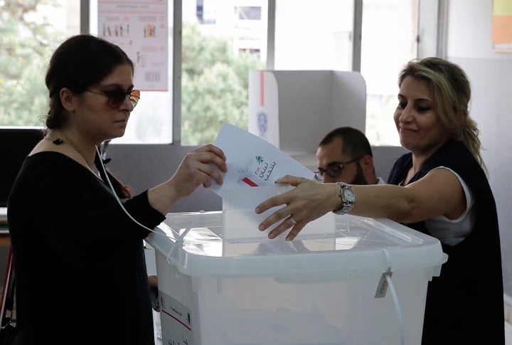 A Lebanese woman casts her vote at a polling station in Ain al-Rummaneh on the southern outskirts of Beirut.