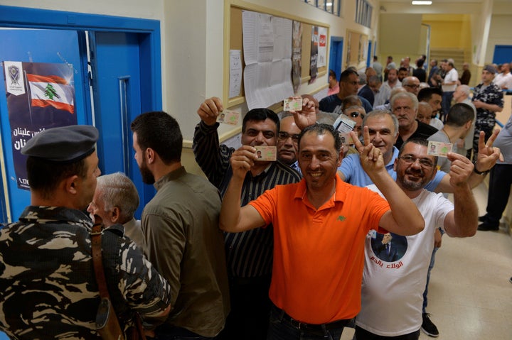 Lebanese voters queue to vote at a polling station during Lebanese general election.