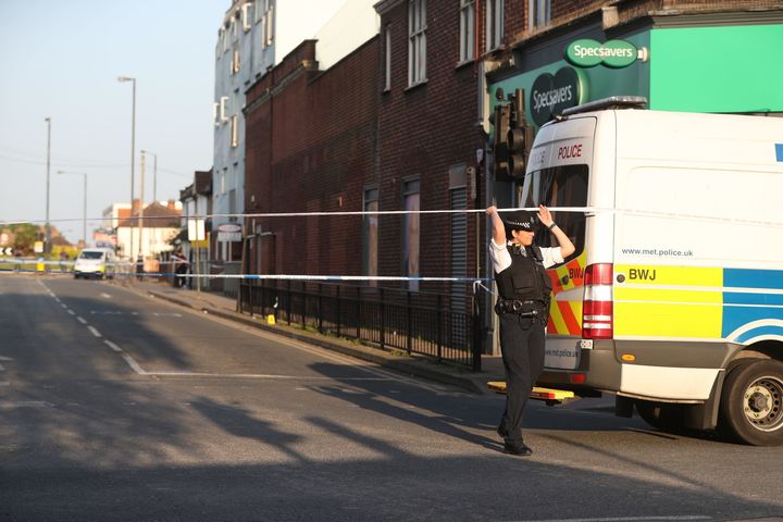 Police at the junction of Palmerston Road and the High Street.