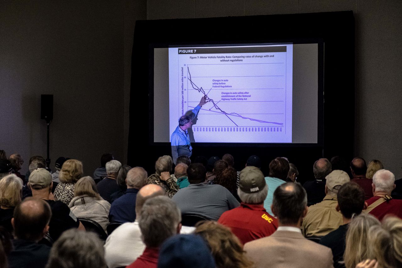 Economist and author John Lott Jr. addresses attendees of "The War on Guns" seminar at the NRA annual meeting on May 6.