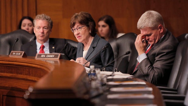 WASHINGTON, D.C. - DECEMBER 12: Flanked by Sen. Rand Paul (R-KY), left and Sen. Bill Cassidy (R-LA), Sen. Susan Collins asks questions of a panel during a hearing of the Health, Education, Labor and Pensions Committee on Capitol Hill in Washington, D.C. on Tuesday, December 12, 2017. (Staff Photo by Gregory Rec/Portland Press Herald via Getty Images)