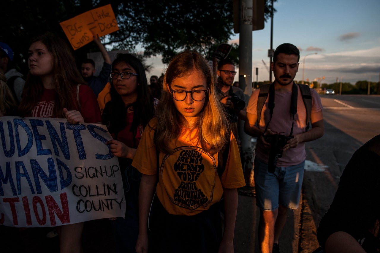 Protesters march to the Kay Bailey Convention center where the NRA annual meeting is being held on May 4.