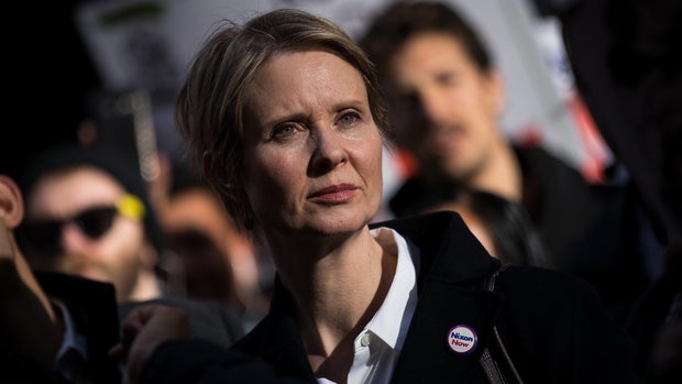 NEW YORK, NY - MAY 1: New York gubernatorial candidate Cynthia Nixon stands with activists as they rally against financial institutions' support of private prisons and immigrant detention centers, as part of a May Day protest near Wall Street in Lower Manhattan, May 1, 2018 in New York City. Across the world, people are protesting and marching on the traditional day of workersÕ rights. (Photo by Drew Angerer/Getty Images)