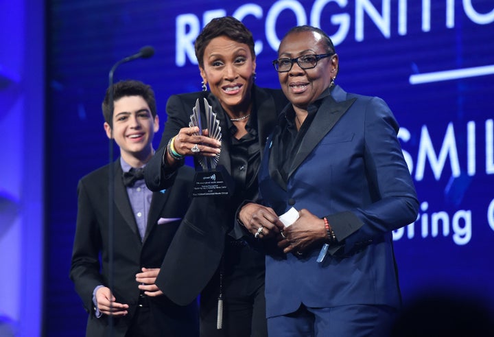 Joshua Rush (left) and Robin Roberts present Gloria Carter with a special recognition award at the 2018 GLAAD Media Awards in New York. 