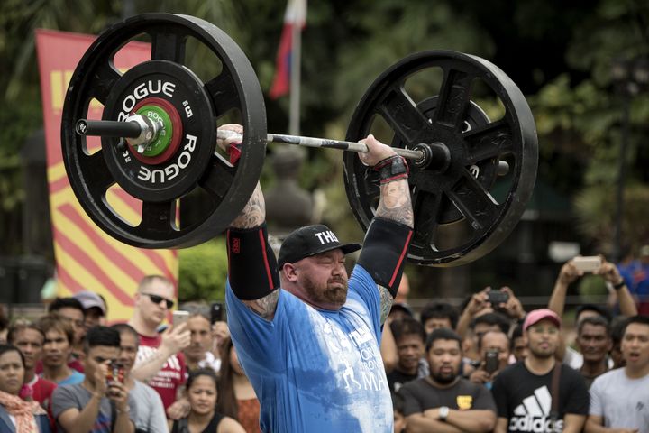 Björnsson lifts weights during the Max Overhead competition.