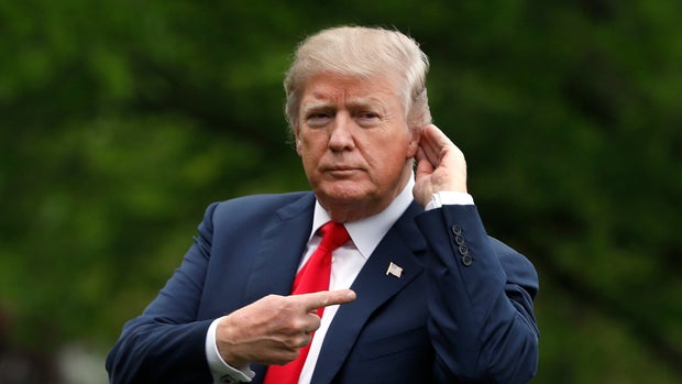US President Donald Trump gestures to the media as walks on the South Lawn upon his return to the White House in Washington from Cleveland, Ohio, on May 5, 2018. (Photo by YURI GRIPAS / AFP)        (Photo credit should read YURI GRIPAS/AFP/Getty Images)