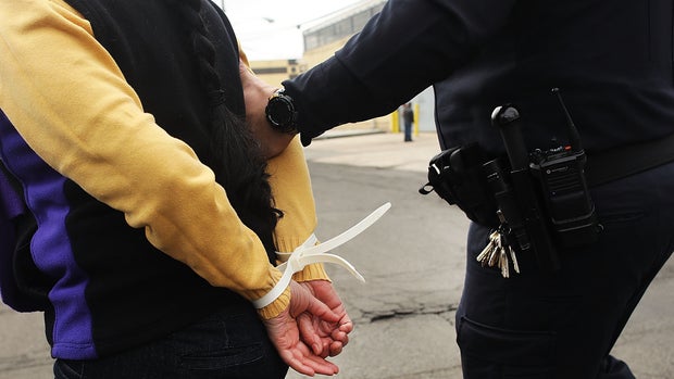 ELIZABETH, NJ - FEBRUARY 23:  Police arrest a protester outside of the Elizabeth Detention Center during a rally attended by immigrant residents and activists on February 23, 2017 in Elizabeth, New Jersey. Over 100 demonstrators chanted and held up signs outside of the center which is currently holding people awaiting deportation. The demonstrators denounced President Donald Trump and his deportation policies. Around the country stories of Immigration and Customs Enforcement (ICE) raids have sent fear through immigrant communities.  (Photo by Spencer Platt/Getty Images)