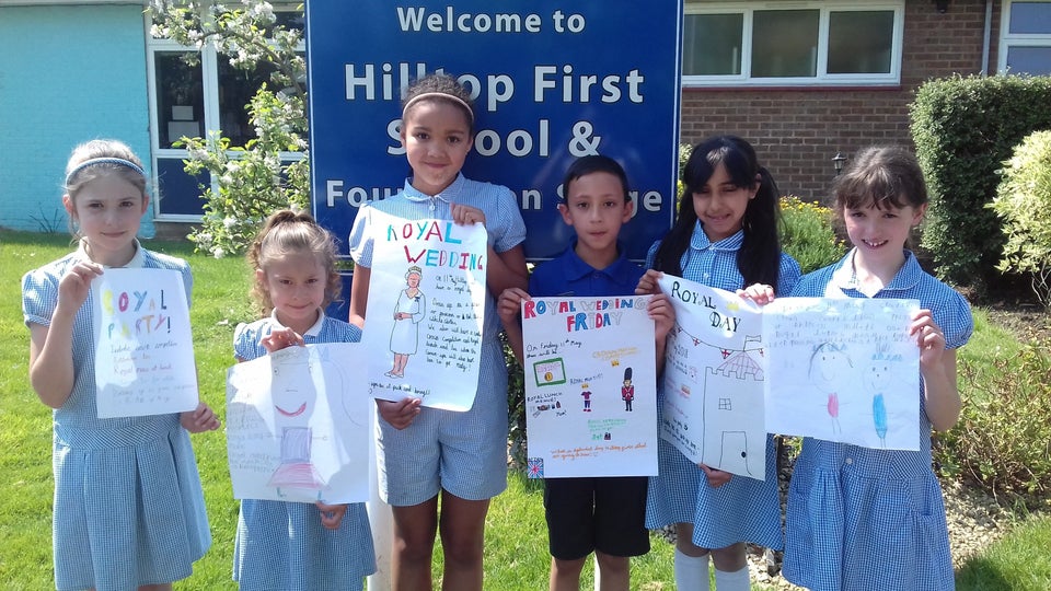 Pupils at Hilltop Primary School with their royal wedding posters. 