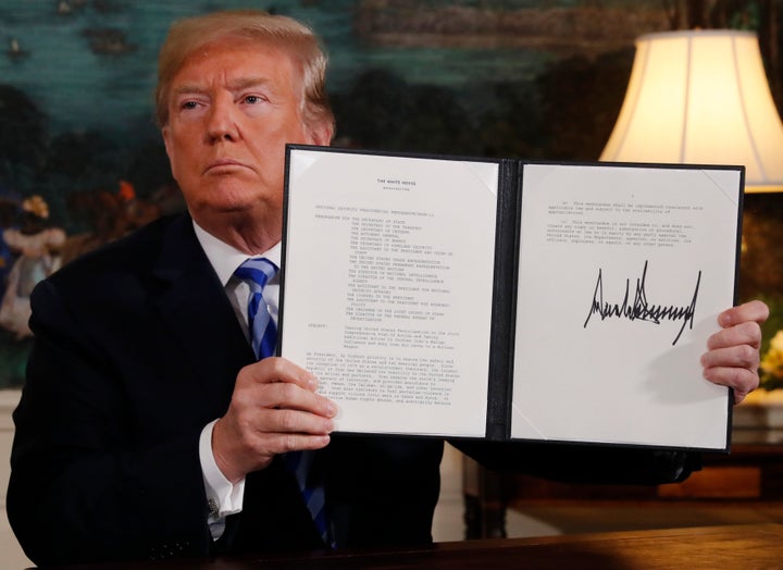 U.S. President Donald Trump displays a presidential memorandum after announcing his intention to withdraw from the JCPOA.