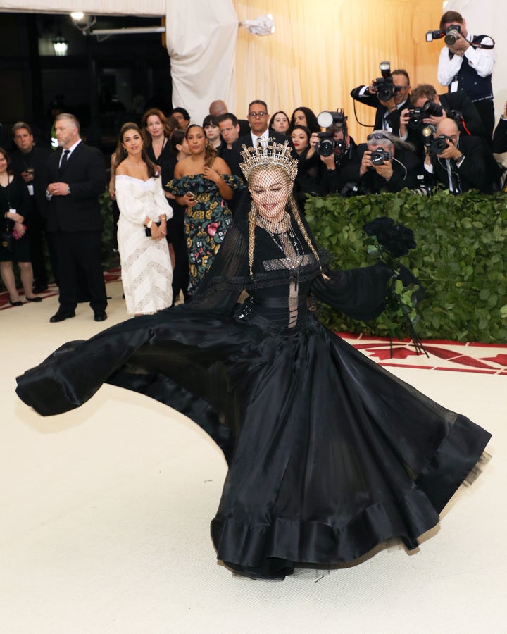 “Tonight I feel so close to God,” Madonna, wearing a black Jean-Paul Gaultier gown, told Vogue. 