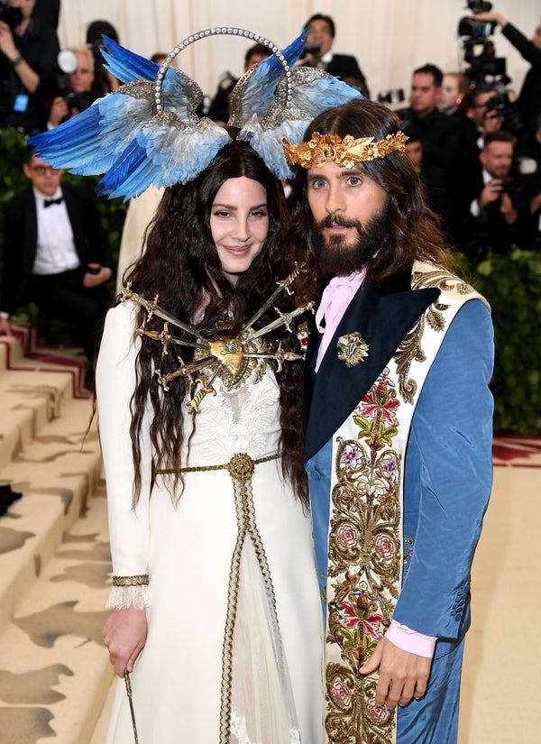 Lana Del Rey, here with Jared Leto, wore a cream-colored Gucci dress and a halo embellished with blue wings. But th
