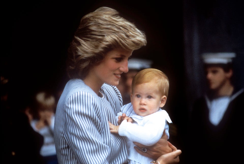 Princess Diana holding Prince Harry as a baby 