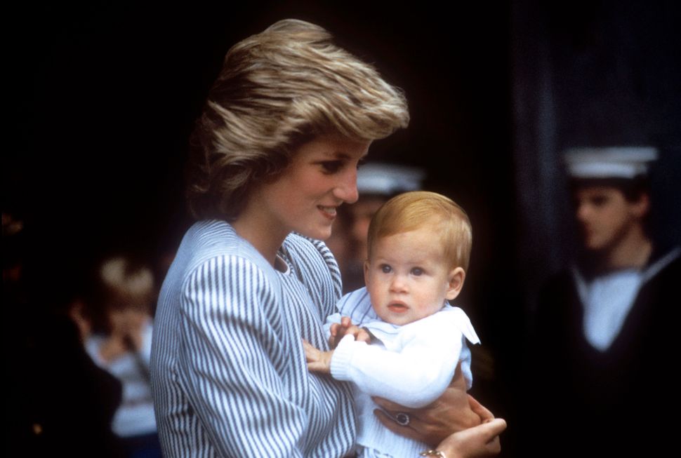 Princess Diana holding Prince Harry as a baby 