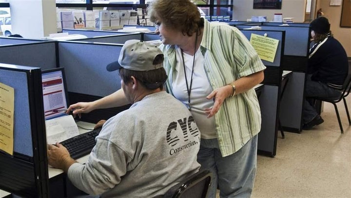 An employment specialist with the Nebraska Department of Labor helps a jobseeker in Omaha.