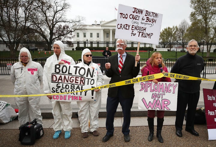 Members of Code Pink protest John Bolton's appointment as President Trump's national security advisor during a rally in front