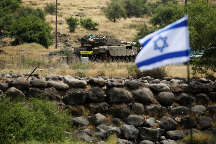 An Israeli tank can be seen near the Israeli side of the border with Syria in the Israeli-occupied Golan Heights, Israel May 9, 2018.