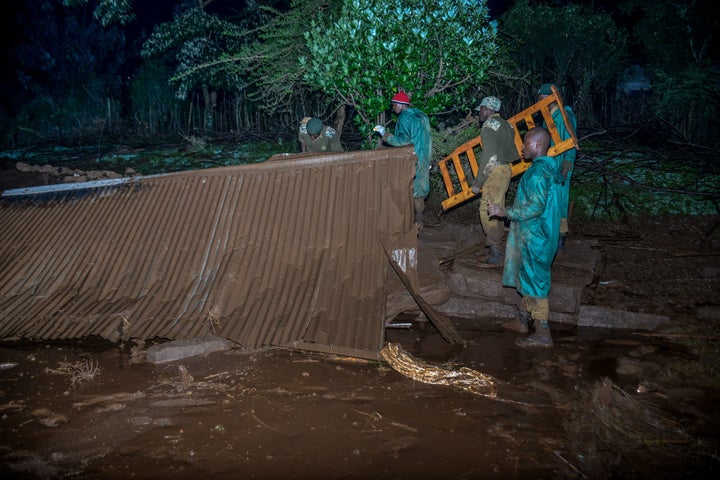 Volunteers search for survivors after a dam burst in Kenya on Thursday and caused “huge destruction,&rdq