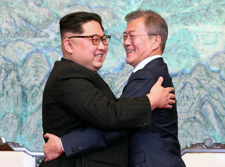 North Korean leader Kim Jong Un (L) and South Korean President Moon Jae-in (R) embrace after signing the Panmunjom Declaration for Peace, Prosperity and Unification of the Korean Peninsula during the Inter-Korean Summit at the Peace House last month.