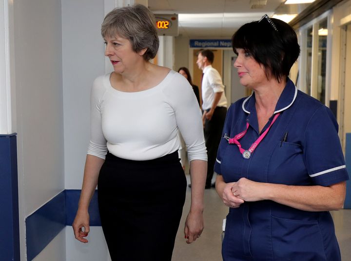 <strong>Theresa May with nurses at Royal Liverpool University Hospital</strong>