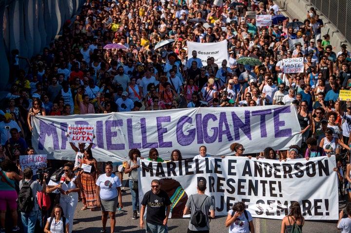 Demonstrators march through Mare, the Rio favela where Marielle Franco was born, to protest her killing in March.