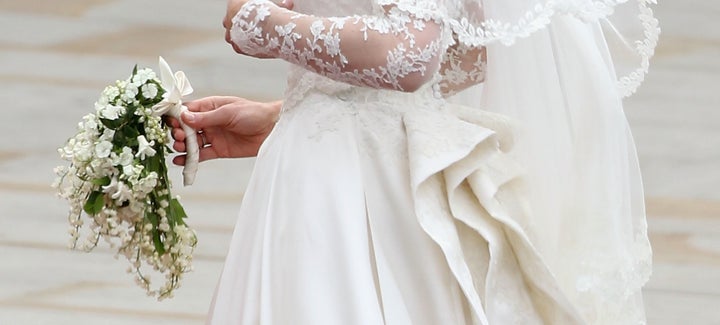 Kate, the Duchess of Cambridge, holding her wedding bouquet, which included a sprig of myrtle.