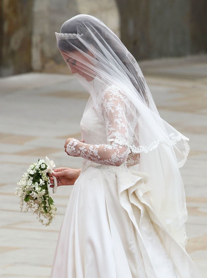 Kate, the Duchess of Cambridge, holding her wedding bouquet, which included a sprig of myrtle.