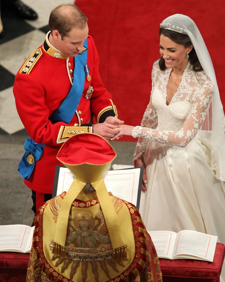 Prince William places the wedding ring on Kate's finger on April 29, 2011.