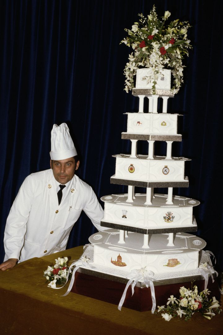 David Avery, head baker at the Royal Naval Cooking School, displays Charles and Diana's multi-tier fruitcake in 1981.