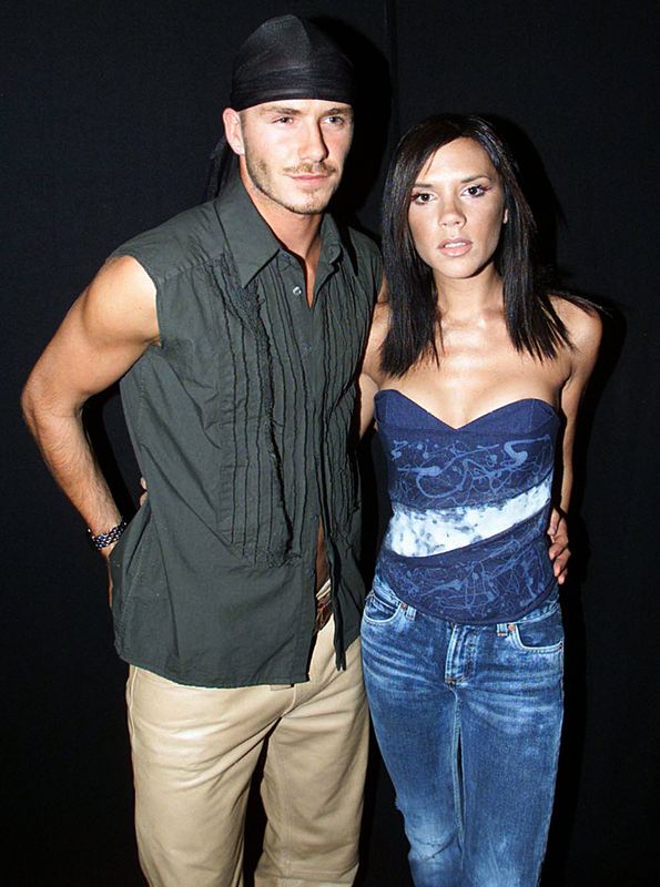 Taking style risks with a durag and sleeveless shirt at&nbsp;the Princes Trust Capital Party in the Park 2000, in London. He actually met Prince Charles on this day.