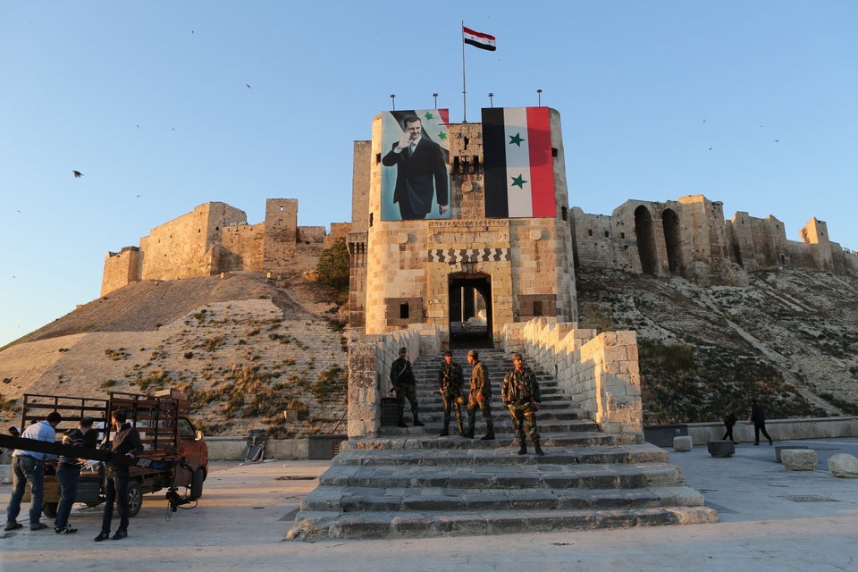 A portrait Syria's President Bashar al-Assad at the Citadel in the old city of Aleppo, a UNESCO World Heritage Site.