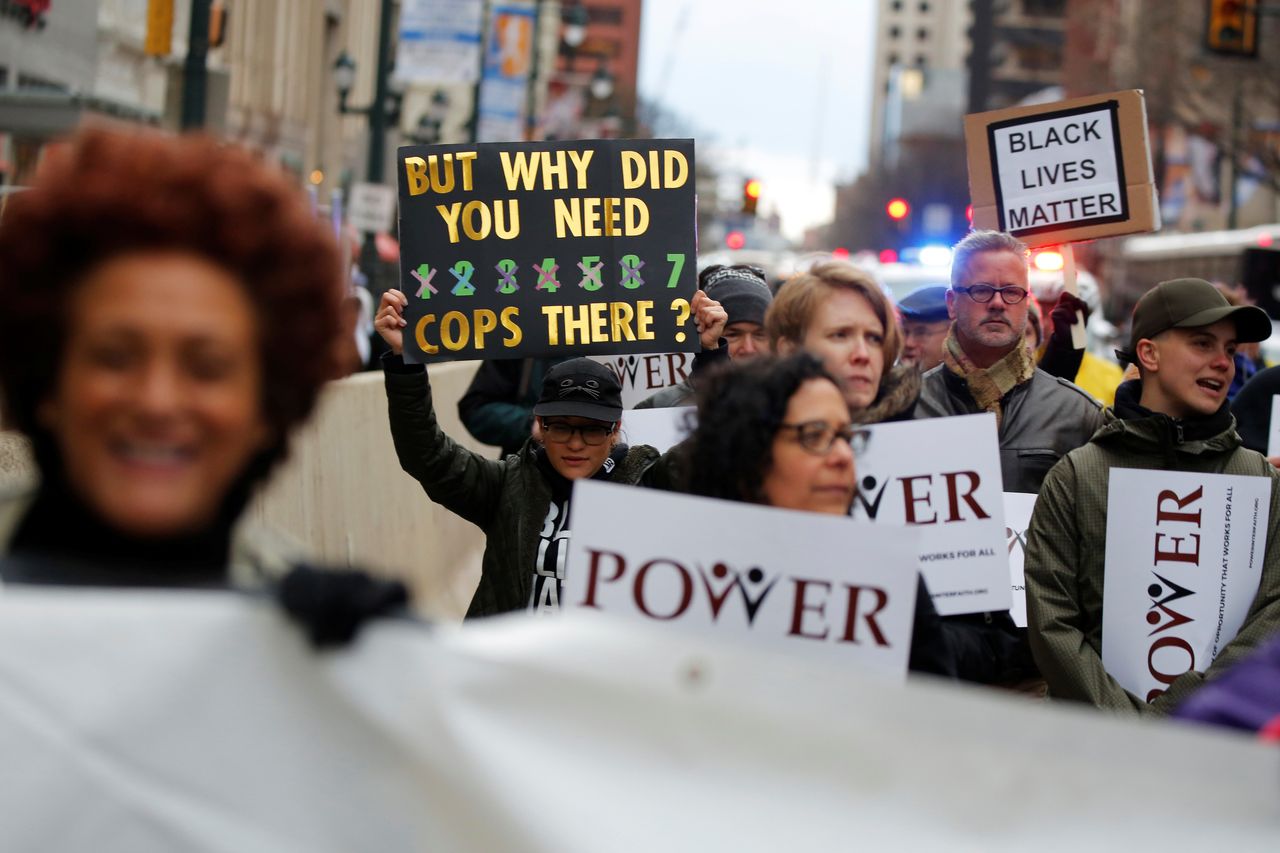 Protesters march in Philadelphia on April 19, a week after two black men were arrested at a local Starbucks.