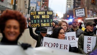 Protesters march down Market Street in Philadelphia, a week after two black men were arrested at a Starbucks coffee shop, in Philadelphia, Pennsylvania, U.S. April 19, 2018.  REUTERS/Dominick Reuter