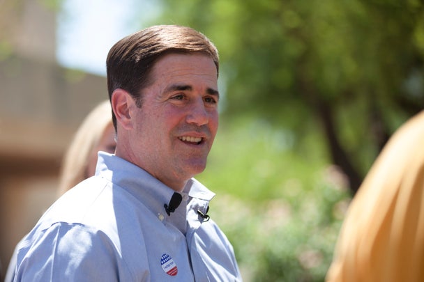 Arizona Republican gubernatorial primary candidate Doug Ducey smiles after voting in the Paradise Valley section of Phoenix, Arizona August 26, 2014. Voters in Arizona go to the polls on Tuesday to select a Republican candidate to vie for the seat of outgoing Governor Jan Brewer, who has repeatedly clashed with the Obama administration over illegal immigration. REUTERS/Samantha Sais (UNITED STATES - Tags: ELECTIONS POLITICS)