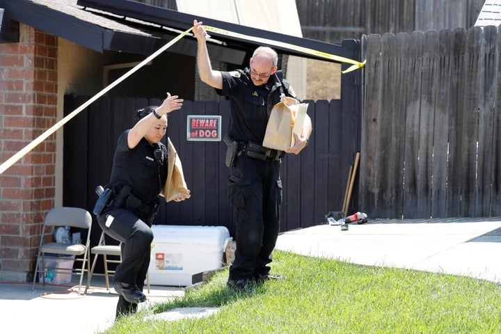 Investigators remove items in evidence bags from the home of Joseph James DeAngelo, who is now charged in 12 previously unsolved homicides.