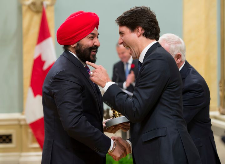 Trudeau jokes with Bains after his swearing-in, Nov. 4, 2015, in Ottawa.