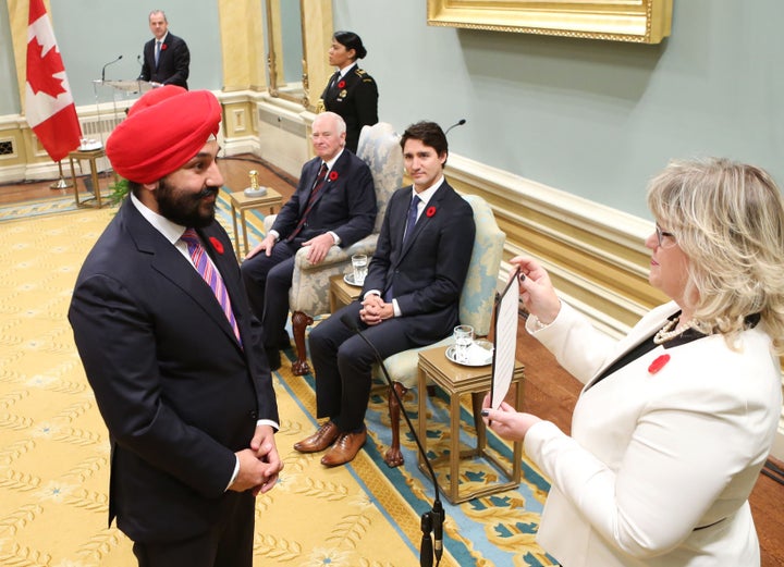 Canada’s Navdeep Bains is sworn in as a Cabinet minister, with Prime Minister Justin Trudeau looking on, in Ottawa in November 2015.