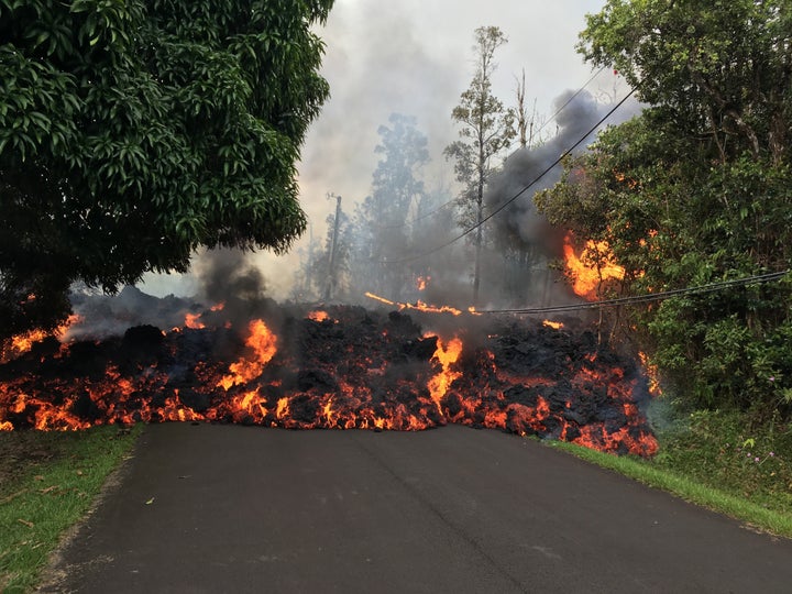 Lava flowing from fissures have claimed roads and homes on Hawaii's Big Island.