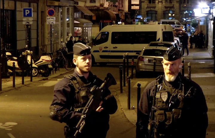 Police guard the scene of a knife attack in Paris on May 12.