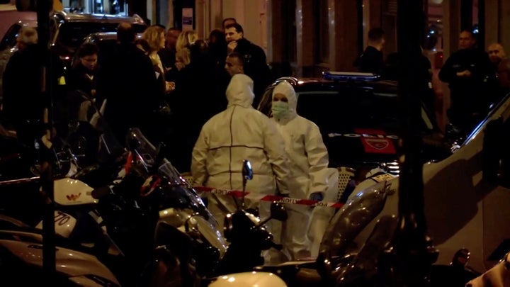 Personnel are seen at the scene of a knife attack in Paris on May 12 in this still image obtained from a video. 