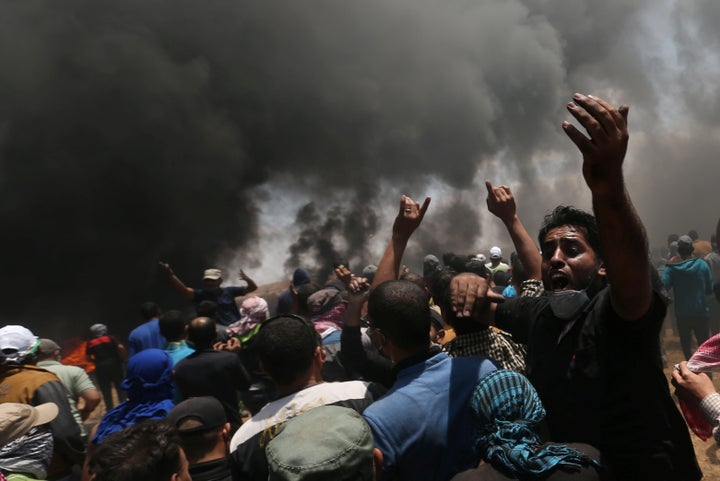 A Palestinian demonstrator reacts during a protest against U.S. embassy move to Jerusalem and ahead of the 70th anniversary o