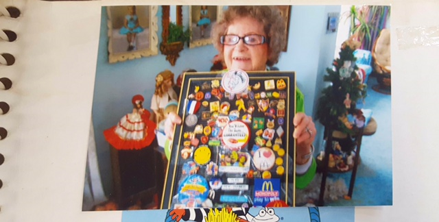 Alice Pirnie holding up some of her McDonald's memorabilia. 