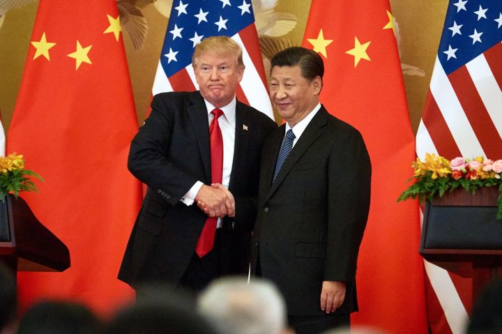 President Donald Trump and China's President Xi Jinping shake hands in Beijing on Nov. 9, 2017.