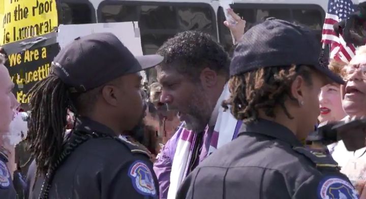 Rev. Barber chants in front of the police line at a Washington, D.C., rally.