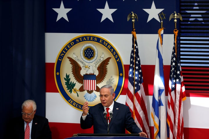 Israeli Prime Minister Benjamin Netanyahu speaks as U.S. Ambassador to Israel David Friedman sits next to him during the dedi