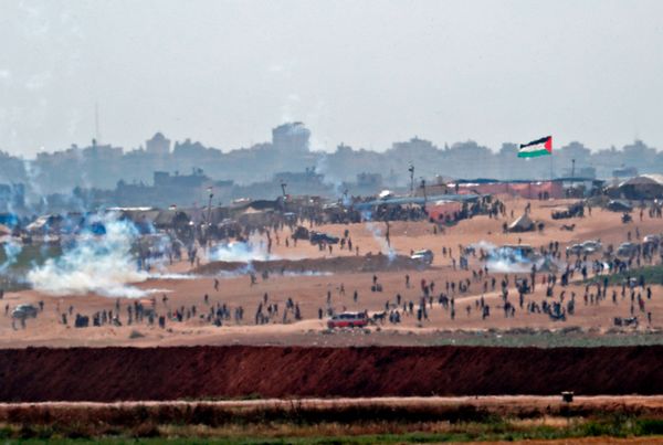 A picture taken on May 15, 2018 from the Israeli kibbutz of Mefalsim shows fumes from tear gas cannisters blowing amidst Pale