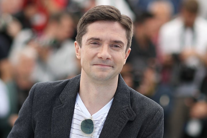 Topher Grace poses on Tuesday during a photocall for the film "BlacKkKlansman" at the Cannes Film Festival in France. 