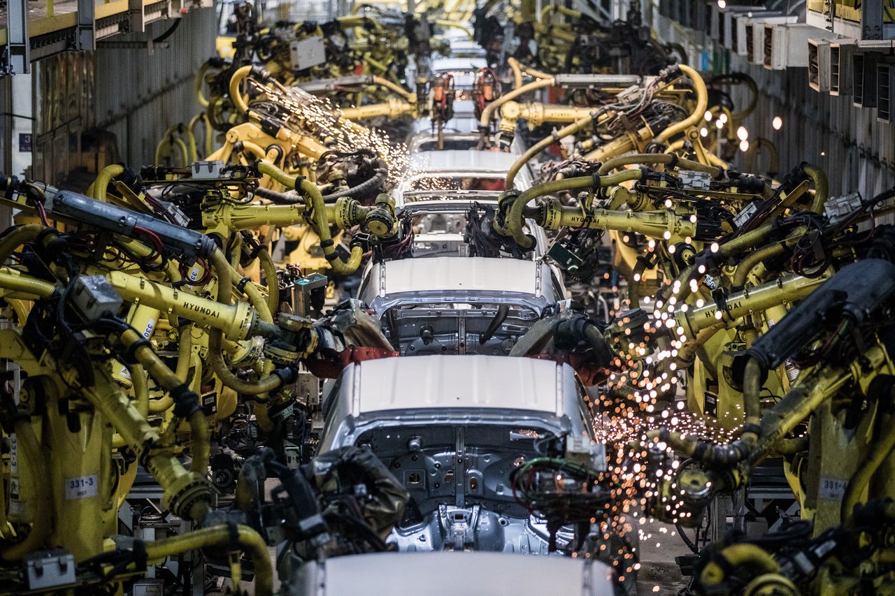 Robot arms weld cars on a factory line at Kia Motors Slovakia plant in Zilina, Slovakia.