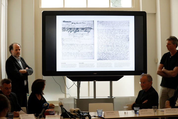 Ronald Leopold (left), executive director of the Anne Frank House, presents two unknown pages of Anne Frank's diary, during a