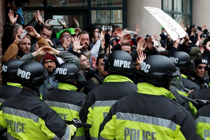 Protesters raise their hands as they're surrounded by police on the sidelines of the Jan. 20, 2017, inauguration in Washington.
