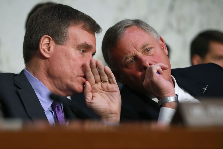 Sen. Richard Burr (right), chairman of the Senate intelligence committee, talks with Warner during Haspel's confirmation hearing.